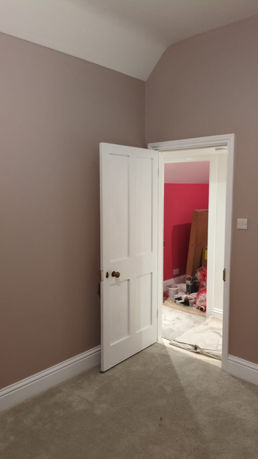 Rogate Construction - Bedroom painted in Petersfield with high ceilings and angled roof